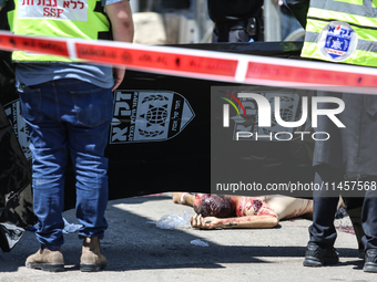 Israeli first responders are working at the site of a stabbing at the checkpoint outside of Jerusalem, Israel, on August 6, 2024, following...