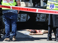 Israeli first responders are working at the site of a stabbing at the checkpoint outside of Jerusalem, Israel, on August 6, 2024, following...