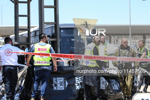 Israeli first responders are working at the site of a stabbing at the checkpoint outside of Jerusalem, Israel, on August 6, 2024, following...