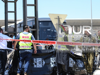 Israeli first responders are working at the site of a stabbing at the checkpoint outside of Jerusalem, Israel, on August 6, 2024, following...