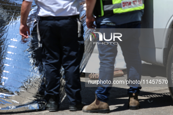 Israeli first responders are working at the site of a stabbing at the checkpoint outside of Jerusalem, Israel, on August 6, 2024, following...