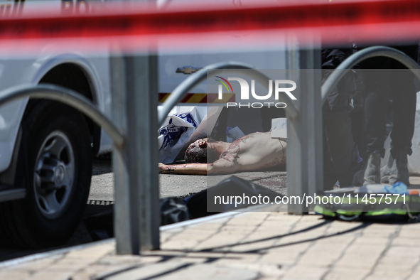 Israeli first responders are working at the site of a stabbing at the checkpoint outside of Jerusalem, Israel, on August 6, 2024, following...