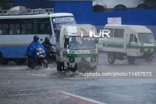 Vehicles are wading through the flooded streets in Kathmandu, Nepal, on August 6, 2024. Nepal's Meteorological Forecasting Division (MFD) un...