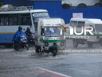 Vehicles are wading through the flooded streets in Kathmandu, Nepal, on August 6, 2024. Nepal's Meteorological Forecasting Division (MFD) un...