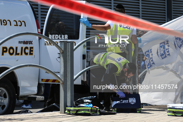 Israeli first responders are working at the site of a stabbing at the checkpoint outside of Jerusalem, Israel, on August 6, 2024, following...