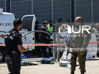 Israeli first responders are working at the site of a stabbing at the checkpoint outside of Jerusalem, Israel, on August 6, 2024, following...