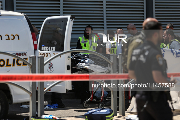 Israeli first responders are working at the site of a stabbing at the checkpoint outside of Jerusalem, Israel, on August 6, 2024, following...