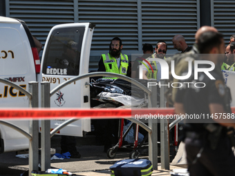 Israeli first responders are working at the site of a stabbing at the checkpoint outside of Jerusalem, Israel, on August 6, 2024, following...