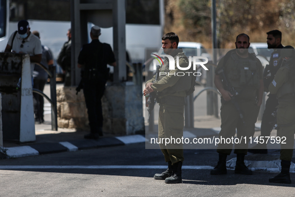 Israeli first responders are working at the site of a stabbing at the checkpoint outside of Jerusalem, Israel, on August 6, 2024, following...