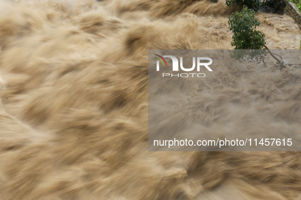 A slow shutter photo is showing the flooded Bagmati River in Chovar, Kathmandu, Nepal, on August 6, 2024. Nepal's Meteorological Forecasting...