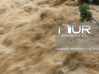 A slow shutter photo is showing the flooded Bagmati River in Chovar, Kathmandu, Nepal, on August 6, 2024. Nepal's Meteorological Forecasting...