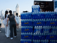 A vendor is selling water at Bund in Shanghai, China, on August 6, 2024. (