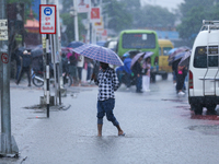 A man is wading through flooded roads in Kathmandu, Nepal, on August 6, 2024. Nepal's Meteorological Forecasting Division (MFD) under the De...