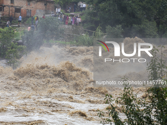 People are watching the flooded Bagmati River at Chovar in Kathmandu, Nepal, on August 6, 2024. Nepal's Meteorological Forecasting Division...