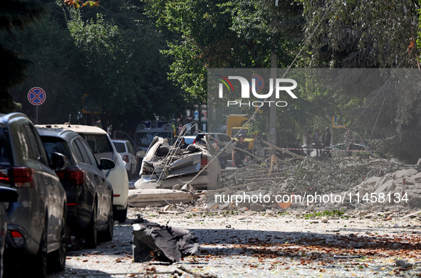 Debris is covering the ground near crushed cars after the Russian rocket attack in Kharkiv, Ukraine, on August 6, 2024. Russians are strikin...