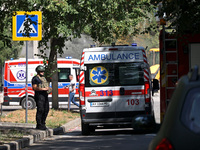 A law enforcer is standing by an ambulance after the Russian rocket attack in Kharkiv, Ukraine, on August 6, 2024. On Tuesday morning, Augus...