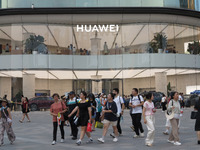 Visitors are passing a Huawei store on Wangfujing Pedestrian Street in Beijing, China, on August 6, 2024. (