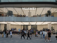 Visitors are passing a Huawei store on Wangfujing Pedestrian Street in Beijing, China, on August 6, 2024. (