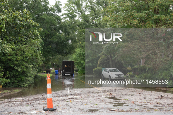 Tropical Storm Debby dropped inches of rain in Charleston, SC, causing businesses to close and prepare for flooding on August 6, 2024. 