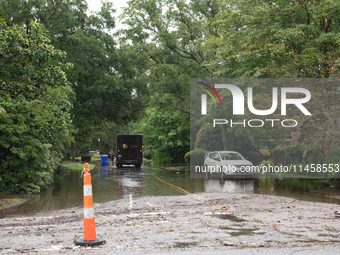 Tropical Storm Debby dropped inches of rain in Charleston, SC, causing businesses to close and prepare for flooding on August 6, 2024. (