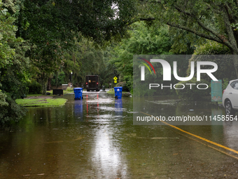 Tropical Storm Debby dropped inches of rain in Charleston, SC, causing businesses to close and prepare for flooding on August 6, 2024. (