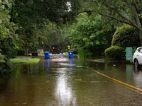 Tropical Storm Debby dropped inches of rain in Charleston, SC, causing businesses to close and prepare for flooding on August 6, 2024. (