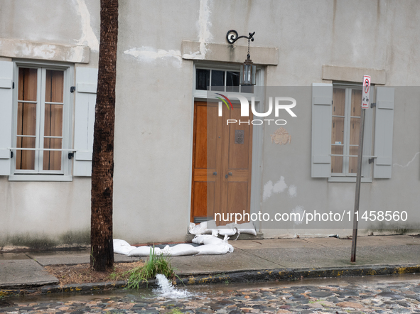 Tropical Storm Debby dropped inches of rain in Charleston, SC, causing businesses to close and prepare for flooding on August 6, 2024. 