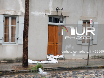 Tropical Storm Debby dropped inches of rain in Charleston, SC, causing businesses to close and prepare for flooding on August 6, 2024. (