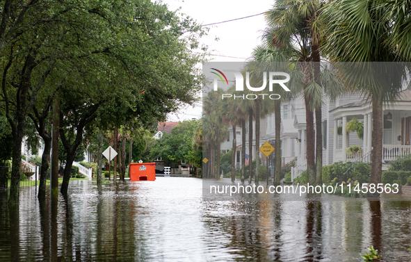 Tropical Storm Debby dropped inches of rain in Charleston, SC, causing businesses to close and prepare for flooding on August 6, 2024. 