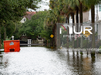 Tropical Storm Debby dropped inches of rain in Charleston, SC, causing businesses to close and prepare for flooding on August 6, 2024. (