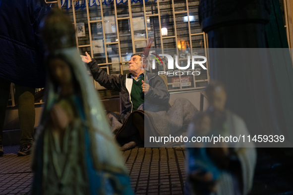 Pilgrims are waiting to enter the church of San Cayetano in Liniers, a working-class neighborhood of Buenos Aires, Argentina, on August 6, 2...