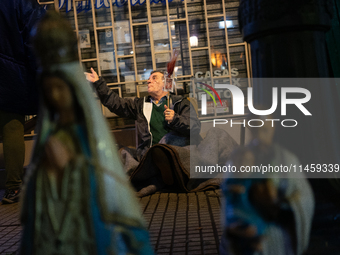 Pilgrims are waiting to enter the church of San Cayetano in Liniers, a working-class neighborhood of Buenos Aires, Argentina, on August 6, 2...