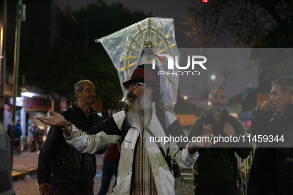 Pilgrims are waiting to enter the church of San Cayetano in Liniers, a working-class neighborhood of Buenos Aires, Argentina, on August 6, 2...