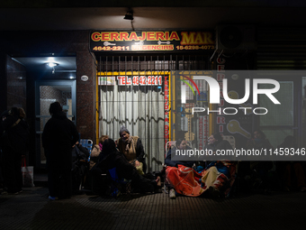 Pilgrims are waiting to enter the church of San Cayetano in Liniers, a working-class neighborhood of Buenos Aires, Argentina, on August 6, 2...