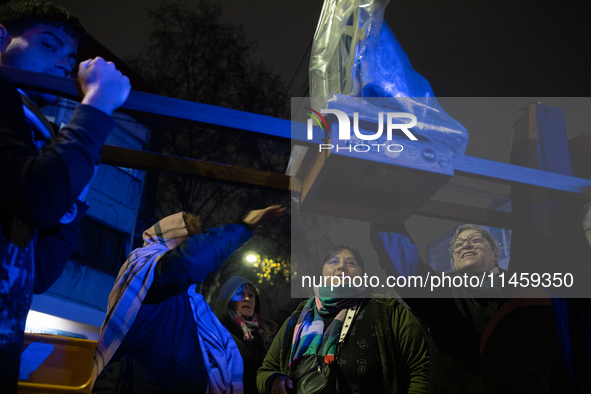 Pilgrims are waiting to enter the church of San Cayetano in Liniers, a working-class neighborhood of Buenos Aires, Argentina, on August 6, 2...