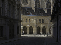 A man walks to work past the Minorite Church in central Vienna early in the morning. Austria, Wednesday, August 7, 2024. (