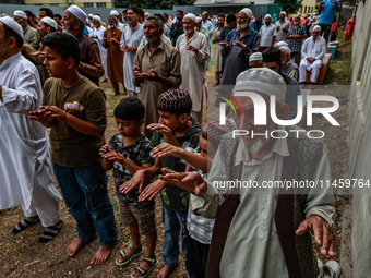 Muslim devotees are taking part in Salatul Istisqa in Sopore, Jammu and Kashmir, India, on August 7, 2024, to pray for an end to the dry hot...