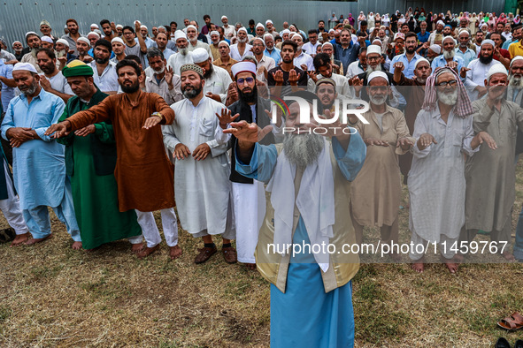 Muslim devotees are taking part in Salatul Istisqa in Sopore, Jammu and Kashmir, India, on August 7, 2024, to pray for an end to the dry hot...