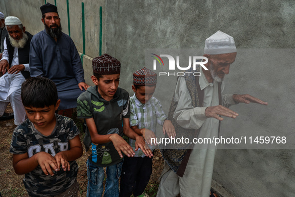 Muslim devotees are taking part in Salatul Istisqa in Sopore, Jammu and Kashmir, India, on August 7, 2024, to pray for an end to the dry hot...