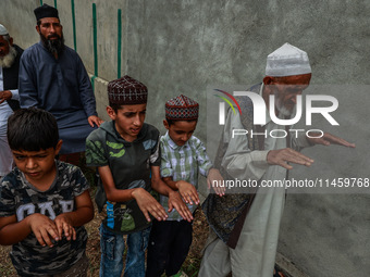 Muslim devotees are taking part in Salatul Istisqa in Sopore, Jammu and Kashmir, India, on August 7, 2024, to pray for an end to the dry hot...