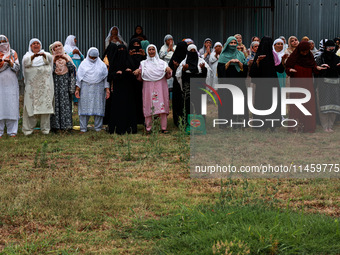 Kashmiri women are praying as Muslim devotees are taking part in Salatul Istisqa in Sopore, Jammu and Kashmir, India, on August 7, 2024, to...