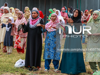 Kashmiri women are praying as Muslim devotees are taking part in Salatul Istisqa in Sopore, Jammu and Kashmir, India, on August 7, 2024, to...