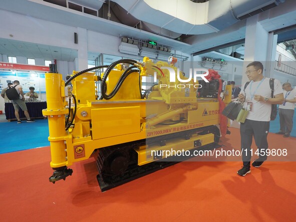 Visitors are visiting a ''Fully hydraulic deep-hole directional drilling rig for coal mines'' at the 2024 Beijing International Coal Mining...