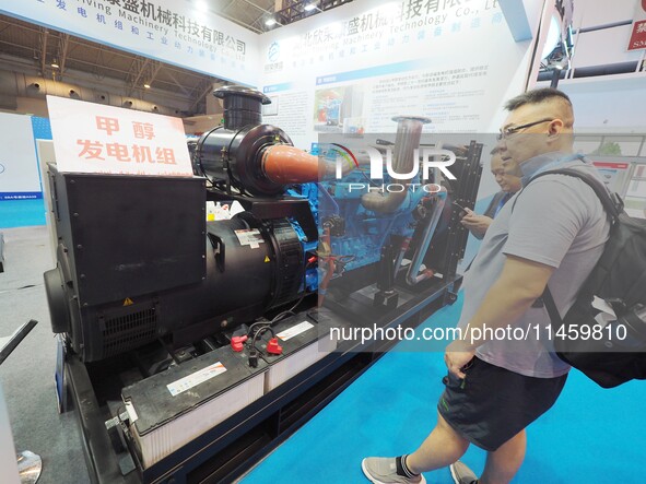 Visitors are visiting a ''methanol generator set'' at the 2024 Beijing International Coal Mining Technology and Equipment Exhibition in Beij...