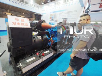 Visitors are visiting a ''methanol generator set'' at the 2024 Beijing International Coal Mining Technology and Equipment Exhibition in Beij...