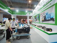 Visitors are visiting a ''High pressure plunger pump'' at the 2024 Beijing International Coal Mining Technology and Equipment Exhibition in...