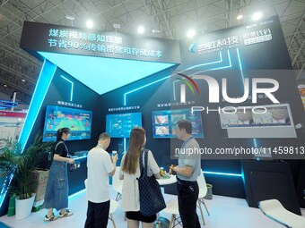 Visitors are visiting the ''Coal Video Sensing Compression'' system at the 2024 Beijing International Coal Mining Technology and Equipment E...