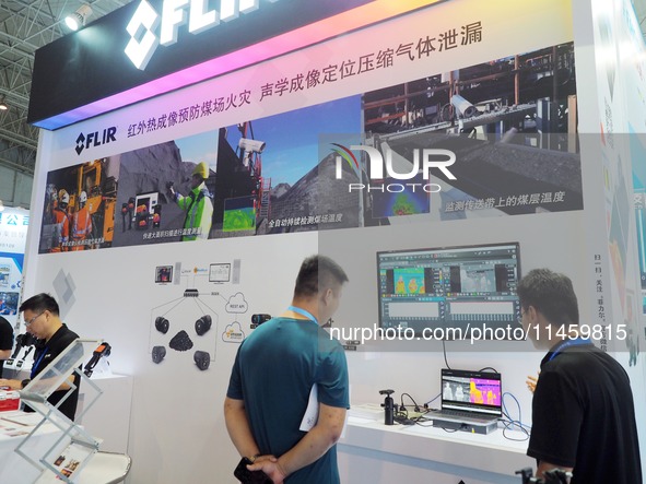 Visitors are visiting the ''Infrared thermal imaging'' coal mine safety monitoring system at the 2024 Beijing International Coal Mining Tech...