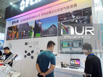 Visitors are visiting the ''Infrared thermal imaging'' coal mine safety monitoring system at the 2024 Beijing International Coal Mining Tech...