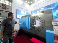 Visitors are visiting the ''Ultra-thin CNC intelligent pipe Press'' at the 2024 Beijing International Coal Mining Technology and Equipment E...